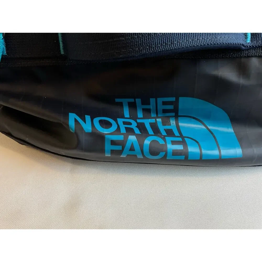The North Face Base Camp Voyager 32L- Black with teal accent